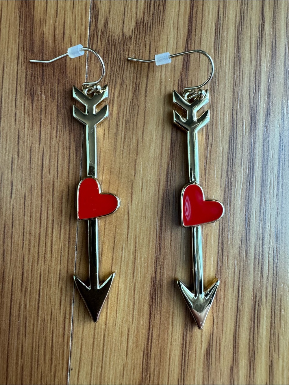 Gold Arrow Earrings with Red Heart Accents